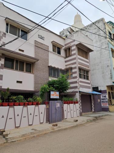 a building on the side of a street at 1 Room for 4 Guests OR 2 BHK for 4 to 10 Guests with AC for Families in Hyderabad