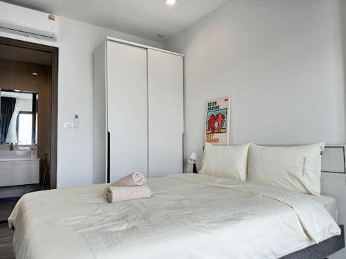 Ένα ή περισσότερα κρεβάτια σε δωμάτιο στο monthly and Annual condo