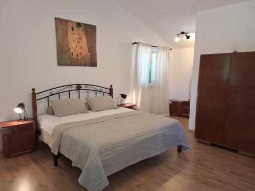 Postel nebo postele na pokoji v ubytování Villa Malini