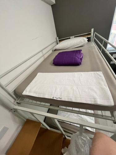 Katil atau katil-katil dalam bilik di PayaThai B&B