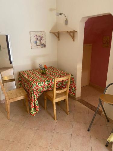 a table in a room with a table cloth on it at La casa nel vicolo in Fabriano