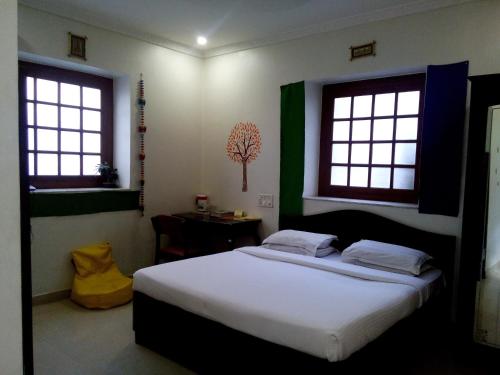 Postel nebo postele na pokoji v ubytování Hotel Ritz