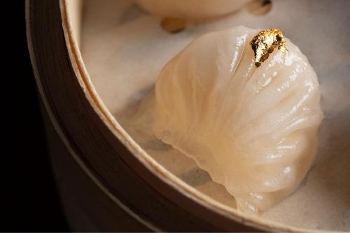 a clam shell with a bug on top of it at The Ritz-Carlton, Hong Kong in Hong Kong