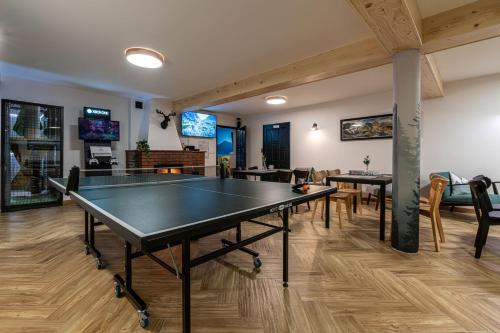 a ping pong room with a ping pong table at Panocek i Babka in Białka Tatrzanska