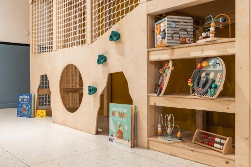 a play room with a large wooden play house at Panocek i Babka in Białka Tatrzanska