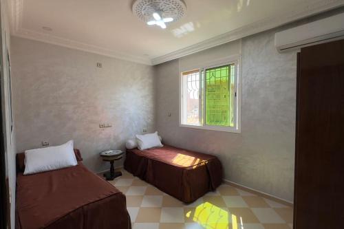 Postel nebo postele na pokoji v ubytování Cosy Appartement in Tiznit