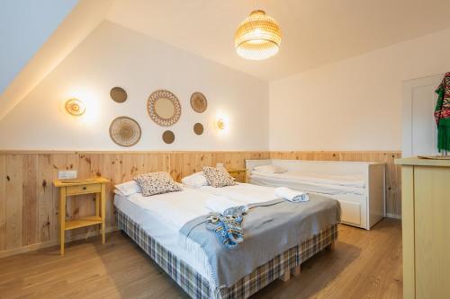 a bedroom with two beds in a room at Panocek i Babka in Białka Tatrzanska