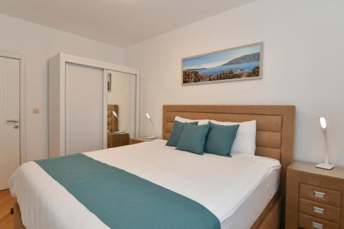 Postel nebo postele na pokoji v ubytování Apart hotel M S KATUNJANIN