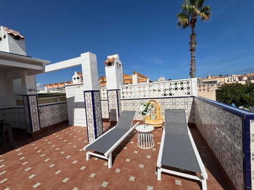 Holiday home with large roof terrace near La Mata beach