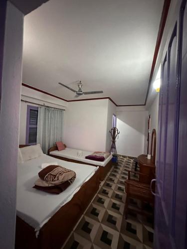 Una cama o camas en una habitación de Hotel Harmony