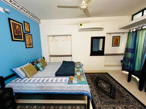 Ένα ή περισσότερα κρεβάτια σε δωμάτιο στο Aura B&B - The Haveli Homestay