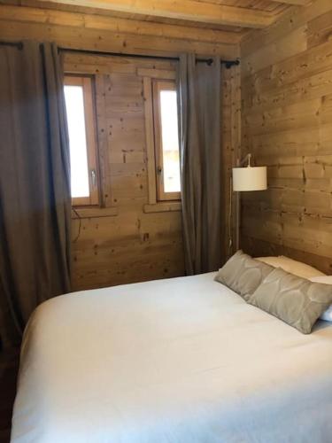 Katil atau katil-katil dalam bilik di Chalet Granger Vars 22 couchages