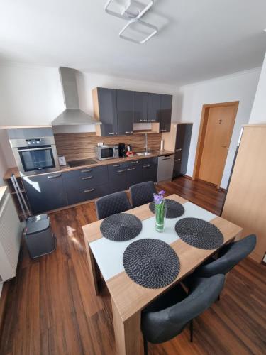 a kitchen and dining room with a table and chairs at 1-2 Personen Zimmer in Kassel in Kassel