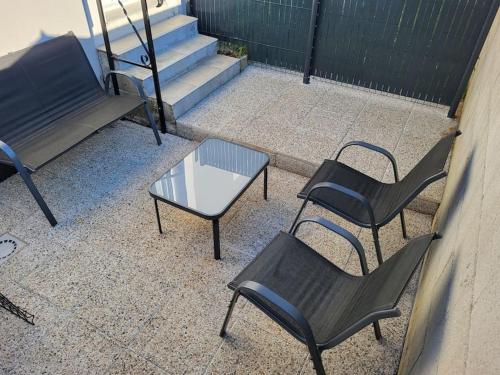 a group of chairs and a table and stairs at Studio La Bâtie-Rolland in La Bâtie-Rolland