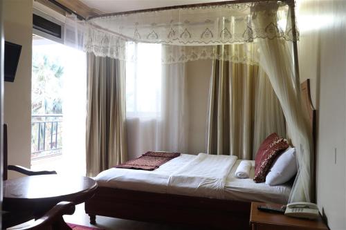 Postel nebo postele na pokoji v ubytování Hotel Intertropics