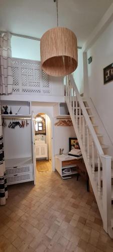 a hallway with a staircase in a house at Dar Inès in Tangier