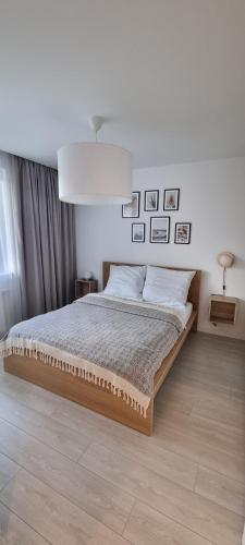 Ένα ή περισσότερα κρεβάτια σε δωμάτιο στο Apartament Zabawa