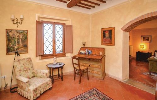 a living room with a desk and a chair at Castello del Calcione in Lucignano