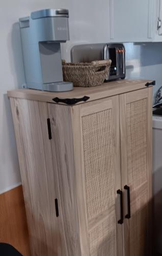 a kitchen cabinet with a microwave on top of it at Aqua Lodges At Hurricane Hole Marina in Key West