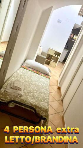 a room with a bed sitting on the floor at Casa Marisa Pozzuoli in Pozzuoli