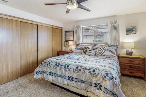 a bedroom with a bed and a ceiling fan at Columbia Vista in Richland