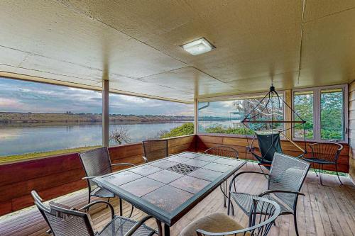 a dining room with a table and chairs on a boat at Columbia Vista in Richland