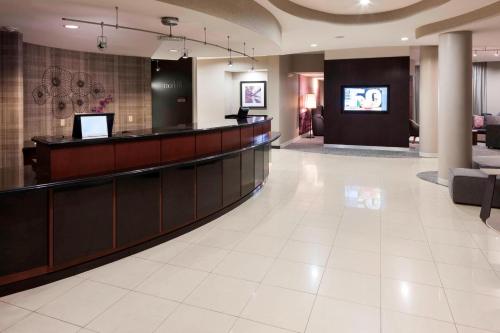 a lobby with a reception desk and a waiting room at Courtyard by Marriott Miami at Dolphin Mall in Miami