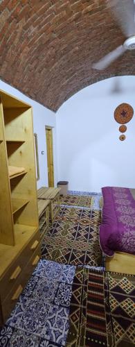 Postel nebo postele na pokoji v ubytování Meshra Katto