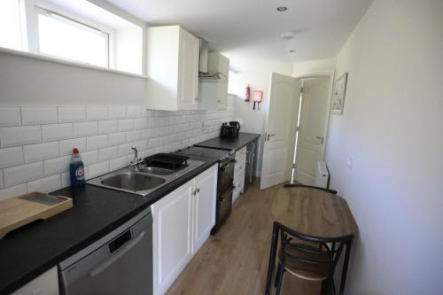 a kitchen with a sink and a counter top at Next Stop Cliffs of Moher in Liscannor