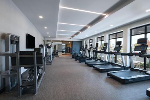 a gym with a row of treadmills and machines at Courtyard by Marriott Colorado Springs North, Air Force Academy in Colorado Springs