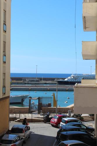 a group of cars parked in a parking lot at La Dolce Vita Civitavecchia in Civitavecchia