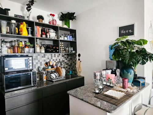 a kitchen with a counter and a counter top at De Pearl Home Tatu City - Nairobi in Nairobi