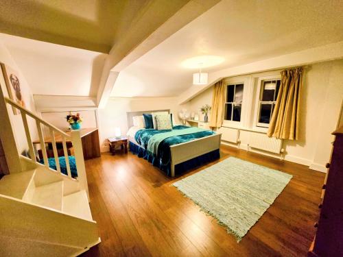 a bedroom with a bed and a rug at Cotswold VIP Regency Lodge in Cheltenham