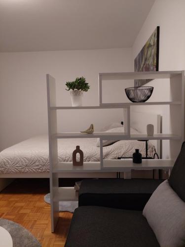 Postel nebo postele na pokoji v ubytování Apartman Aleja