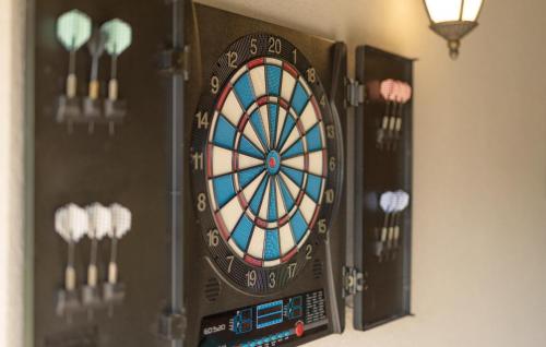 a dart board on a wall with some darts at Awesome Home In Gospic With Wifi in Gospić