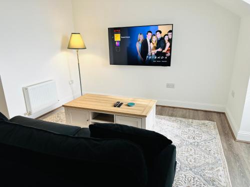 Barnet House Serviced Apartmentsにあるテレビまたはエンターテインメントセンター