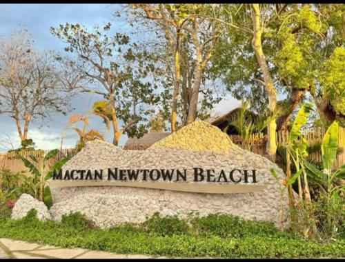 a sign at the entrance to macan newtownhaven beach at Mactan Newtown Beach Condo in Mactan