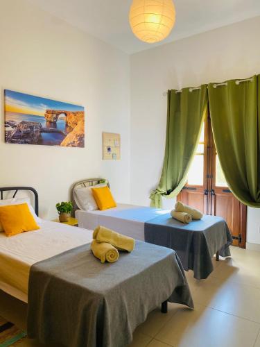 Un ou plusieurs lits dans un hébergement de l'établissement Spinola Shoreline Homestay St Julians