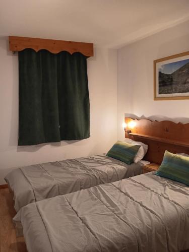 Postel nebo postele na pokoji v ubytování Chamrousse 1700 - Les Villages du Bachat - Silènes C23 - Classé 3 étoiles