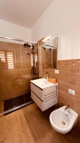 a bathroom with a sink and a shower at La Perla del sur in Bari
