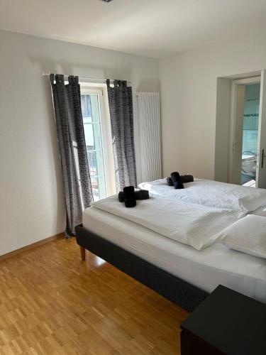 Postel nebo postele na pokoji v ubytování Interlaken Best View Deluxe Apartment