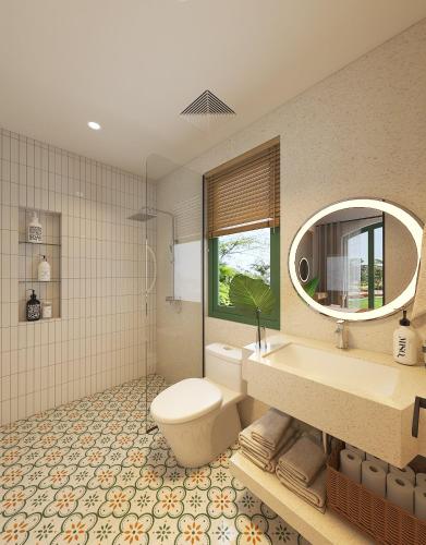 a bathroom with a toilet and a sink and a mirror at Plum Village Moc Chau in Mộc Châu