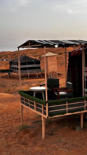a tent in the middle of a field at Sunrise Desert Local Private Camp in Bidiyah