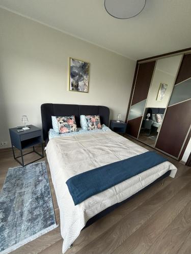 Ένα ή περισσότερα κρεβάτια σε δωμάτιο στο Apartament Relax 55