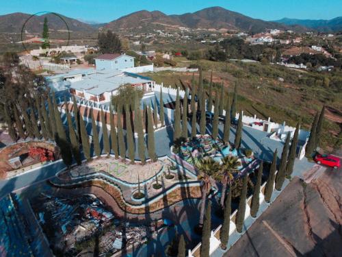 an overhead view of a roller coaster with palm trees at Casa Ciprés in Valle de Guadalupe