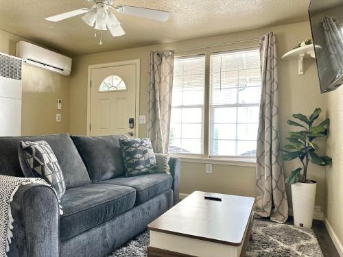 a living room with a blue couch and a table at Near Downtown- Kitchen-washerdryer-parking in Medford