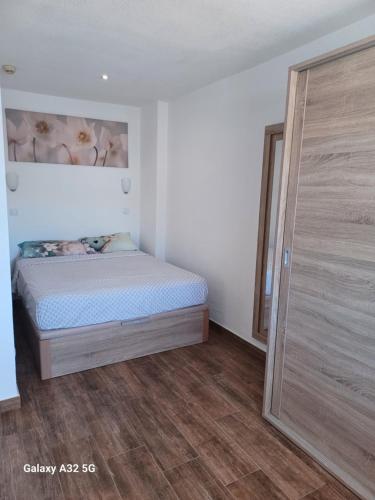 Ένα ή περισσότερα κρεβάτια σε δωμάτιο στο Isola Felice