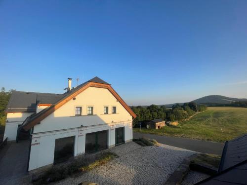 a house sitting on the side of a road at Centrum Slezská Harta in Razová