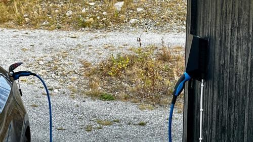a tv attached to the side of a house at Modern cabin, great view, sunny, 2BA, 4BR in Hemsedal