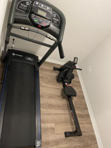 a room with a exercise machine on the floor at Modern, well-equipped, and centrally located in Fonthill